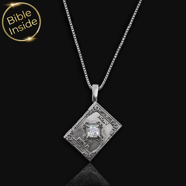 Minimalist biblical necklace with book charm holding nano Bible technology
