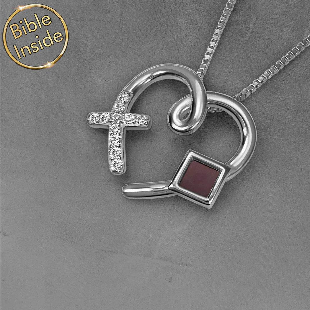Silver Bible on jewelry featuring heart pendant for Christian women