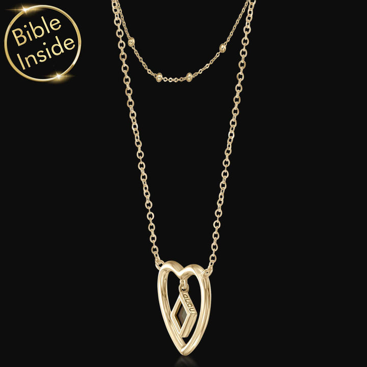 Women's religious jewelry featuring elegant heart and scripture chip