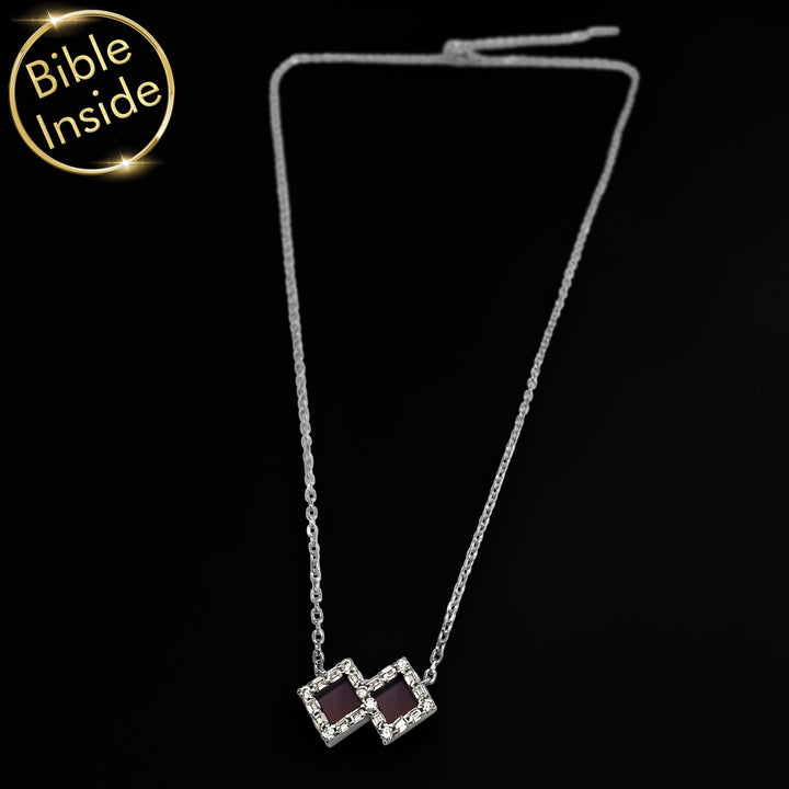 Christian Bible verse on jewelry with microscopic Testament inside