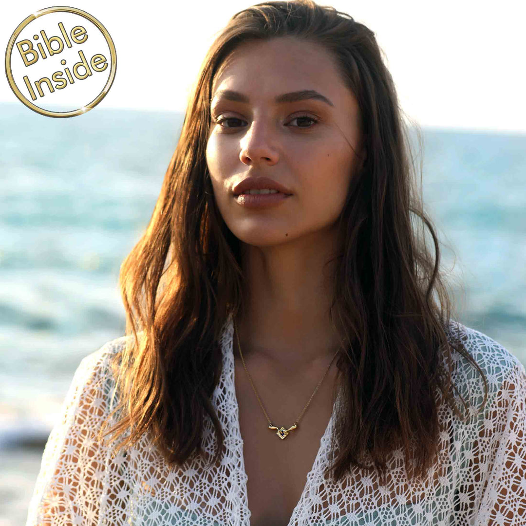 Gold Genesis pendant featuring tiny New Testament for daily wear